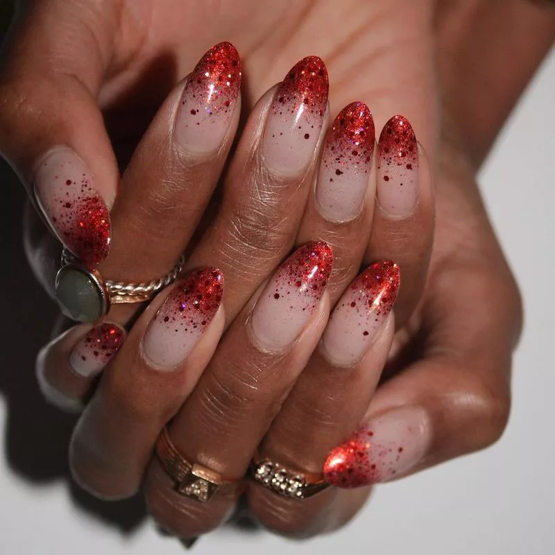 Manicure with red glitter gradient tips