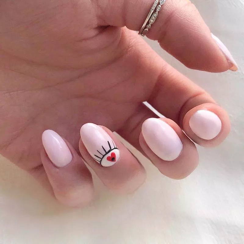 Nude nails with heart designs