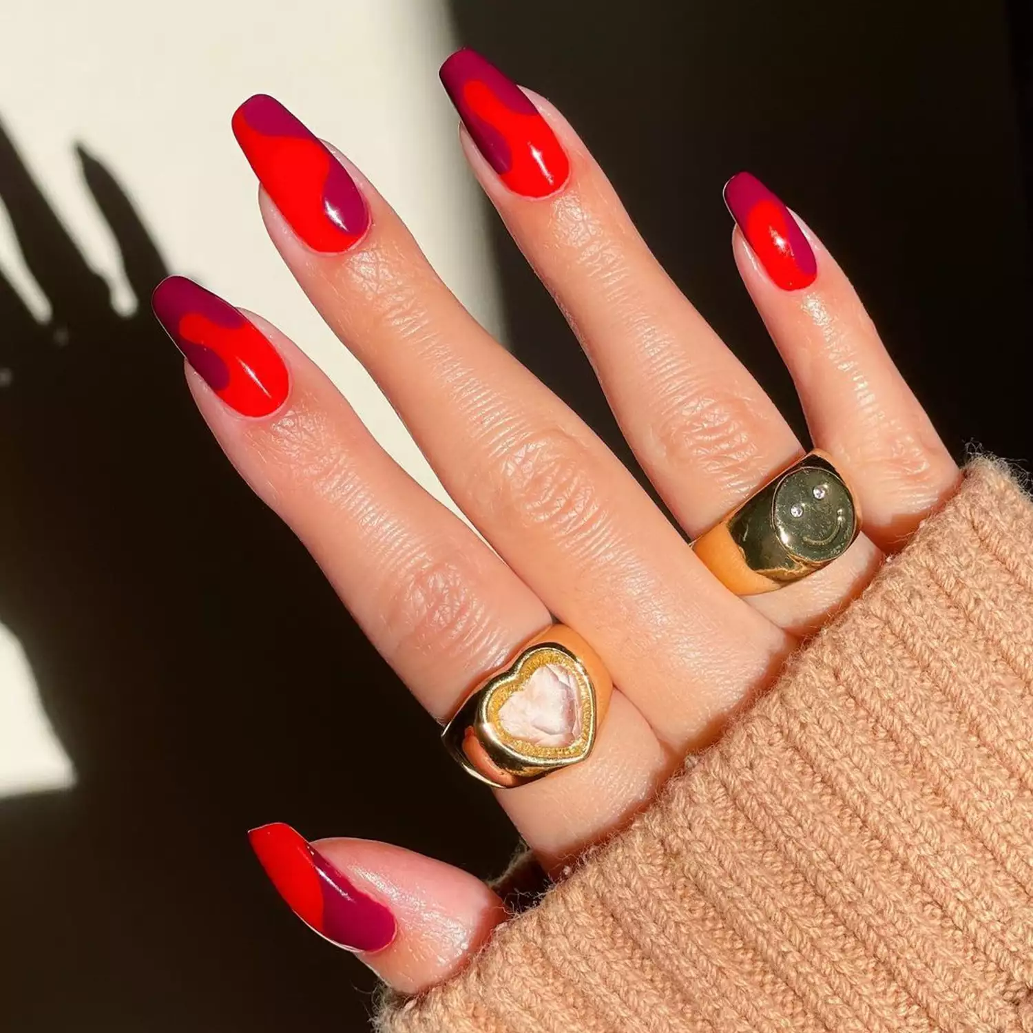 Burgundy and red colorblock swirl nails