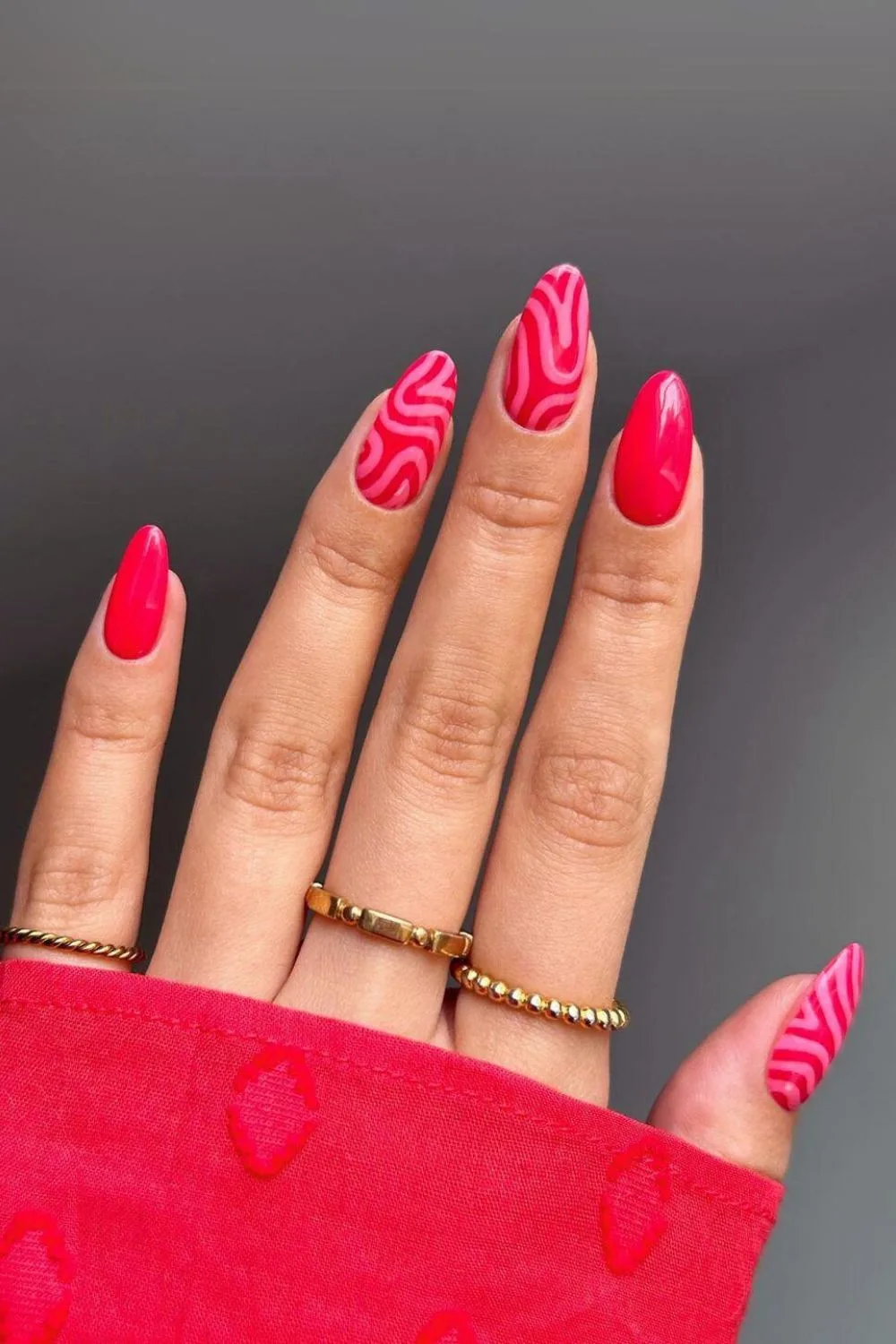 Red nails with abstract swirls