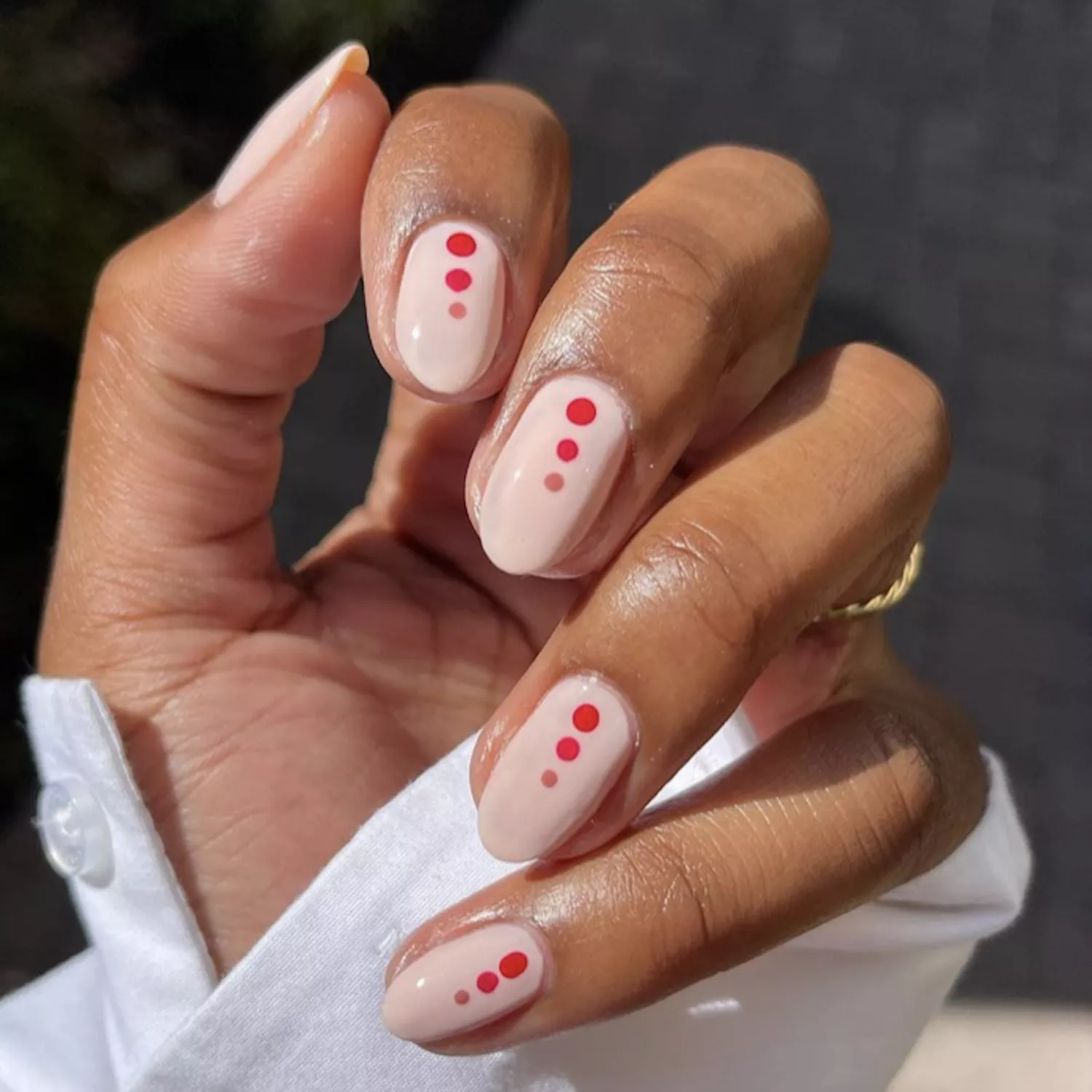 Red and white dot nail manicure