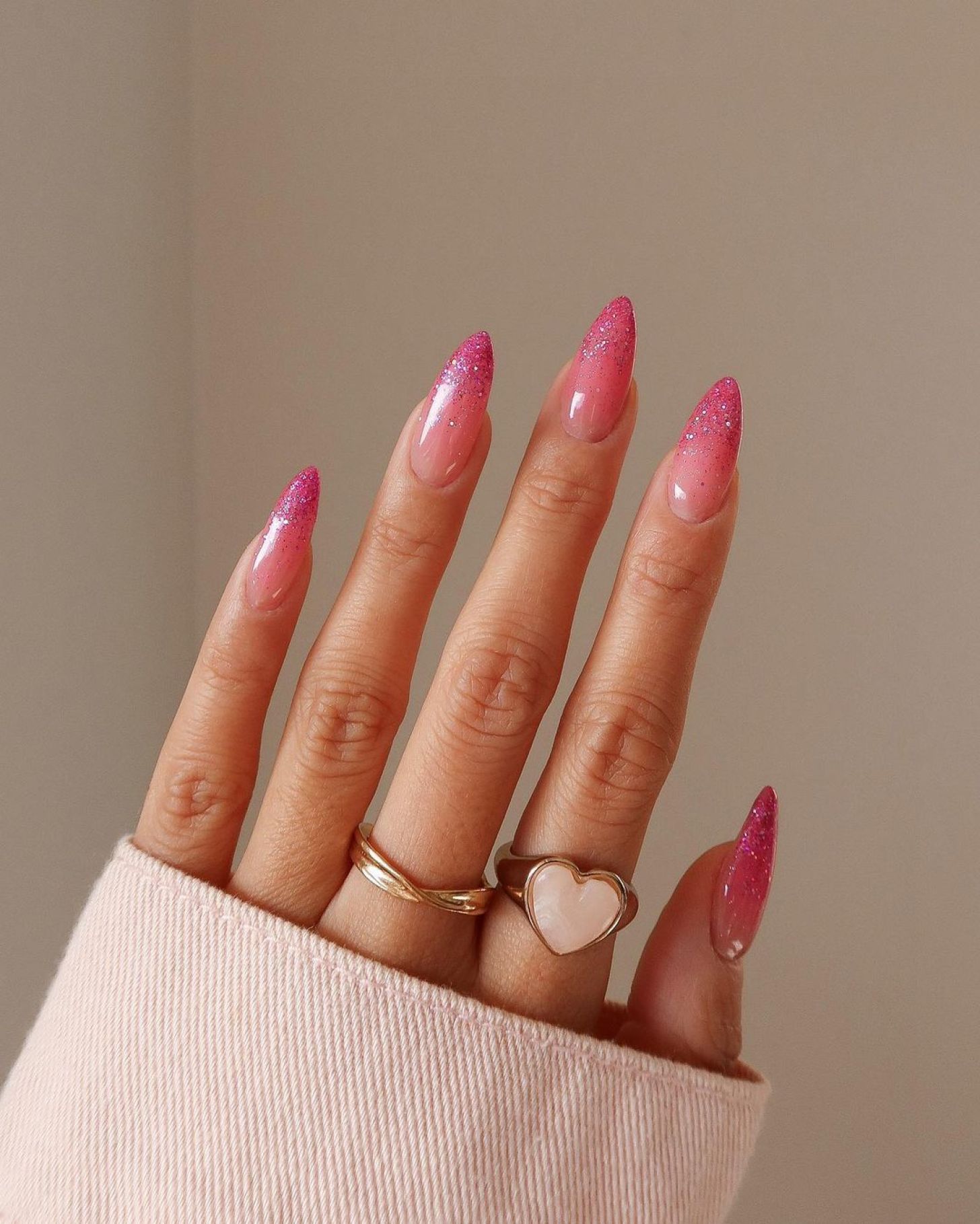 Pink ombré nails with glitter accents