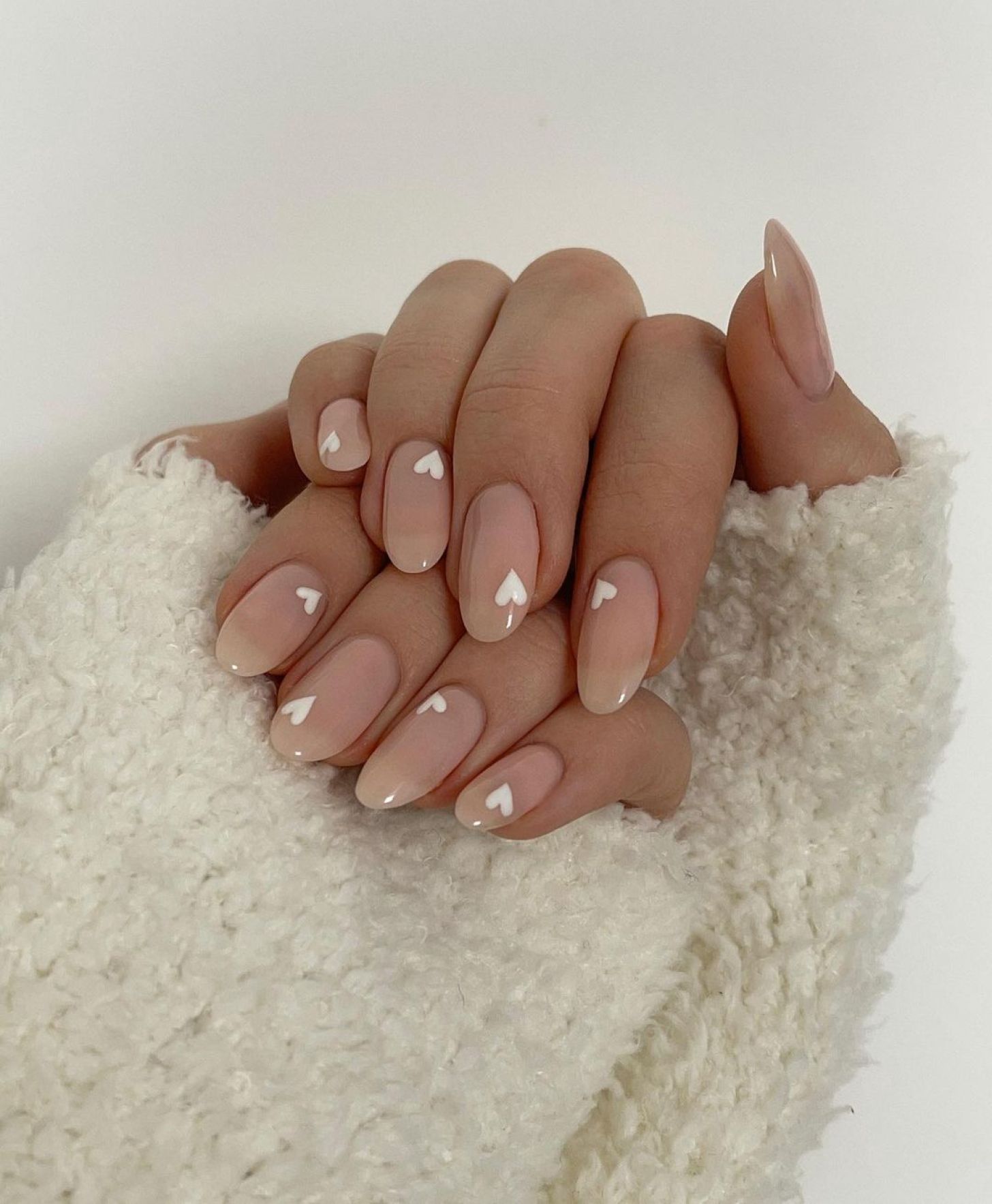 cute nude simple Valentine's Day nails with small white heart nail art designs