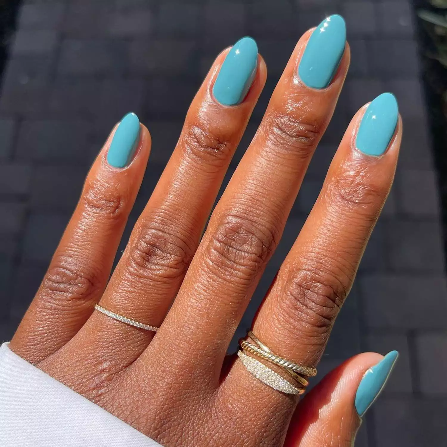 Close up of a turquoise manicure