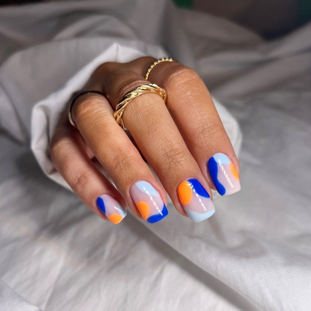 Blue nails with orange accents